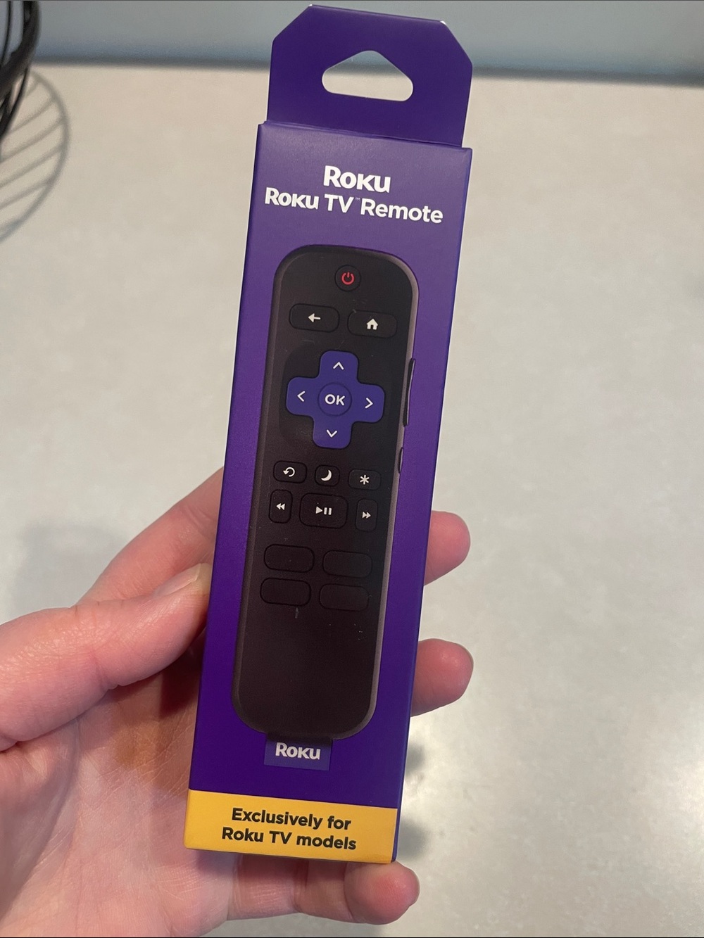 Roku TV Remote with Purple Accent in Purple Box